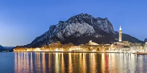 Northern Lakes Prints: Lake Como, Lombardy, Italy. Lecco city at dusk with St Martin mount in the background