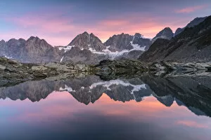 Lake of Forbici during sunrise and in background Bernina Group, Valmalenco, Valtellina, Sondrio Province, Lombardy