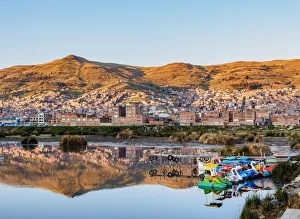 Images Dated 8th November 2017: Lake Titicaca and Cityscape of Puno at sunrise, Peru