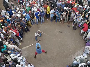Lamu crowds watch a stick fight along the waterfront at Lamu town