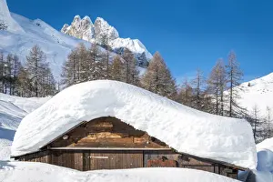Construction Prints: landscape of snow-covered mountain huts in the locality Ciamp de Lobia, Fedaia pass