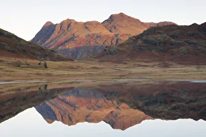 Blea Tarn Prints: The Langdale Pikes glow with the first light of dawn