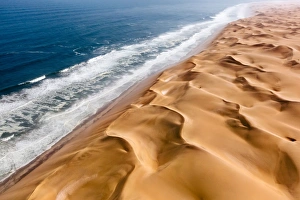 Langewand, Aerial view of where the Atlantic Ocean meets the sea of dunes in Western Langewand, Aerial view of where the Atlantic Ocean meets the sea of dunes in Western