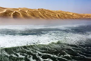 Langewand, where the Atlantic Ocean meets the sea of dunes in Western Namibia Langewand, where the Atlantic Ocean meets the sea of dunes in Western Namibia