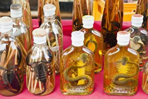 Images Dated 6th March 2012: Laos, Luang Prabang, Ban Xang Hai Village, Display of Locally Made Lao Whiskey
