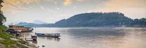 Images Dated 4th February 2018: Laos, Luang Prabang, Riverboats on the Mekong River, sunset