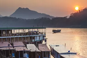 Images Dated 11th February 2018: Laos, Luang Prabang, Riverboats on the Mekong River, sunset