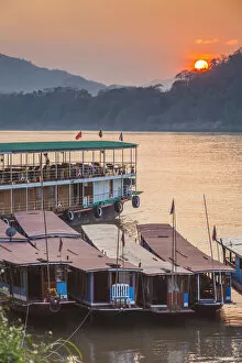 Images Dated 11th February 2018: Laos, Luang Prabang, Riverboats on the Mekong River, sunset