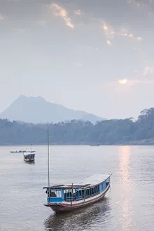 Images Dated 6th September 2018: Laos, Luang Prabang, Riverboats on the Mekong River, sunset