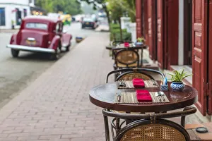 Images Dated 6th September 2018: Laos, Luang Prabang, Sisavangvong Road, cafe table