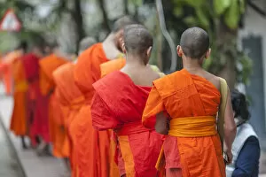 Images Dated 4th February 2018: Laos, Luang Prabang, Tak Bat, dawn procession of Buddhist monks collecting alms