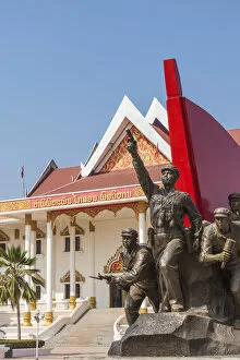 Laos, Vientiane, Kaysone Phomivan Museum, building exterior and revolutionary sculpture