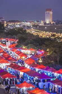 Laotian Prints: Laos, Vientiane, Mekong Riverfront Night Market, high angle view, dusk