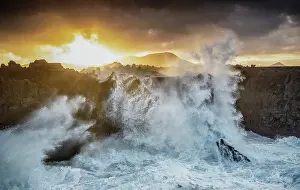 Storm Prints: Large waves breaking on the volcanic coastline at Los Hervideros at sunrise