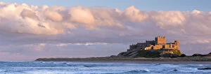 Late evening sunlight bathes against the Bamburgh Castle stronghold on the Northumberland