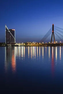Images Dated 7th September 2010: Latvia, Riga, Vansu Bridge, Swedbank building, and Daugava River, evening