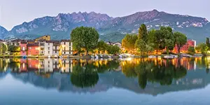 Street Lights Prints: Lecco, Lombardy, Italy. Panoramic view of the colorful houses and the Mount Resegone