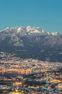 Resegone Prints: Lecco province at dusk with Resegone mount in the background viewed from San Tomaso