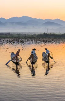 Leg-rowing fishermen of Inle Lake at dawn, Shan State, Myanmar