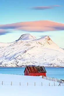 Mountain Peak Prints: Lenticular cloud at dawn on a lone cabin overlooking the fjord, Tromso, Norway