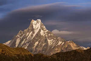 Lenticular clouds forming above Machapuchare, Himalayas, Nepal