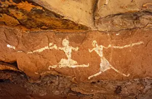 Art Work Prints: Libya, Fezzan, Jebel Akakus. A pair of running figures painted onto the walls of Uan Muhuggiag