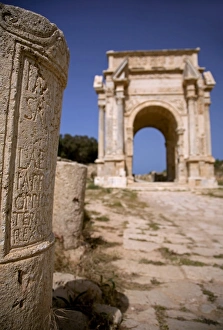 Arch Way Gallery: Libya; Tripolitania; Khums; An inscription on a stone and the Arch of Septimius Severus