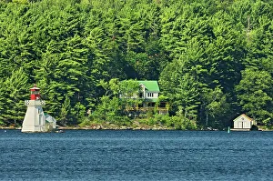 Rosseau Prints: Lighthouse and cottage on Lake Rosseau, Near Rosseau, Ontario, Canada