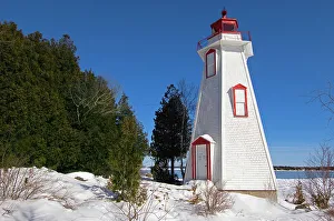 Bruce Peninsula Prints: Lighthouse on Georgian Bay in winter Tobermory, Ontario, Canada