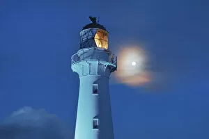 Rocky Coast Collection: Lighthouse and full moon - New Zealand, North Island, Wellington, Masterton, Castlepoint
