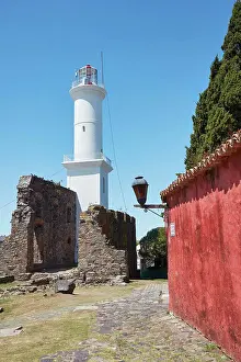 Street Lamp Prints: The lighthouse and a Portuguese traditional house in the historical cask of Colonia del Sacramento