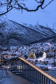 Connection Prints: Lights of car trails on Bruvegen Bridge with the snowy Arctic Cathedral on background
