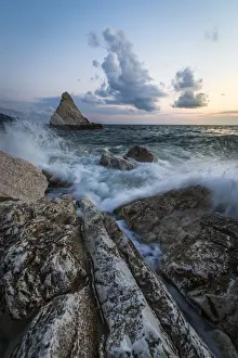 Conero Prints: The lights of dusk on the waves crashing on cliffs La Vela Beach Portonovo province