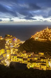 Liguria Gallery: The lights of the sea village of Vernazza with the typical crib on the hill