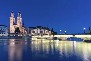 Downtown District Prints: Limmatquai, Grossmunster Cathedral and Munsterbrucke bridge at dusk, Zurich, Switzerland