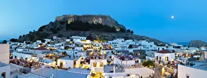 Acropolis Of Lindos Gallery: Lindos Acropolis & Rooftop Restaurants illuminated at dusk, Lindos, Rhodes, Greece