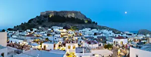 Lindos Acropolis & Rooftop Restaurants illuminated at dusk, Lindos, Rhodes, Greece