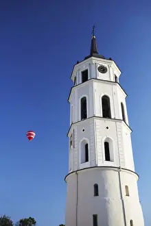 Lithuania, Vilnius, Hot Air Balloon Flying Past Vilnius Cathedral Belfry