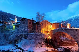 Lights Prints: Little village of Bormio after snowfall during dusk