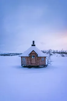 Images Dated 25th May 2022: little wooden hut on the iced lake Tornetrask, Arctic Circle