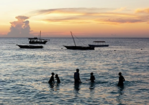 Zanzibar Prints: Local boys playing in the sea at sunset, Nungwi, Zanzibar, Tanzania