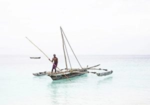 Nungwi Prints: Local fisherman on his old wooden dhow, Nungwi, Zanzibar, Tanzania