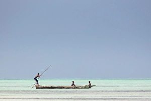 Local Fishermen Prints: Local fishermen in an open wooden boat on the sea, Jambiani, Zanzibar, Tanzania