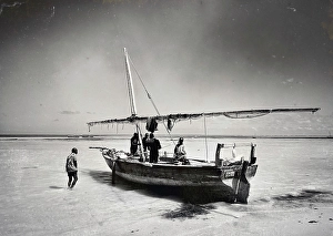 Dhow Prints: Local fishermen preparing their dhow for a fishing trip out at sea