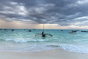Zanzibar Prints: Local fishermen on a traditional dhow, in stormy weather, Nungwi, Zanzibar, Tanzania