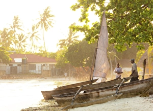 Zanzibar Prints: Two local men and dhows on the beach, Nungwi, Zanzibar, Tanzania
