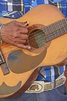 Detail of a local traditional musician with a guitar in the historic center of Campeche, Yucatan, Mexico