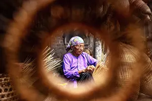 Craft Prints: Local woman crafting bamboo fish traps, Hanoi, Vietnam. (MR)