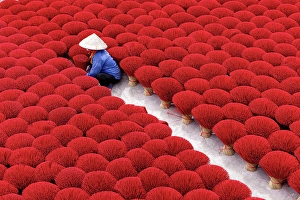 Incense Sticks Prints: Local woman laying out colourful Incense sticks to dry