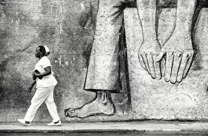 Havana Centro Prints: Local woman walking past street art on a wall in Havana Centro, Havana, Cuba, Caribbean